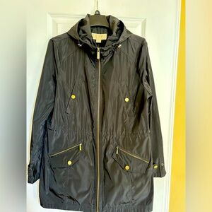 Michael Kors black nylon jacket with hood and zipper pockets. Size Large